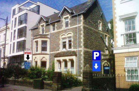 photo of City Marshall Massage location at Quaker Meeting House cardiff. Photo of building entrance and a sign showing where the free parking is located