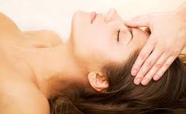 lady having reiki healing and chakra balancing in Cardiff with crystal therapy