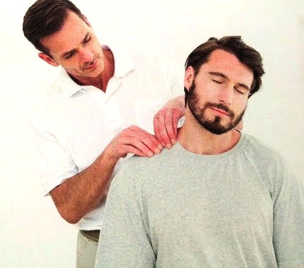 man having neck pain massage in Cardiff