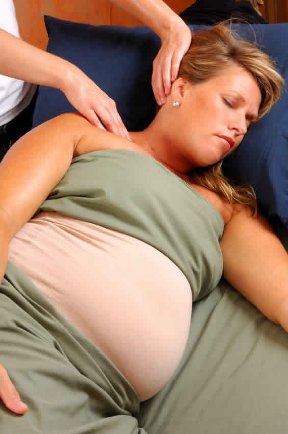 pregnant woman in Cardiff clinic having prenatal pregnancy massage