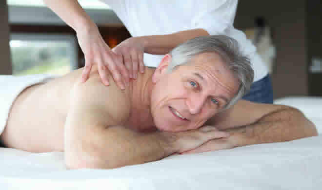 old man in Cardiff having sports massage trigger point therapy for his Sciatica